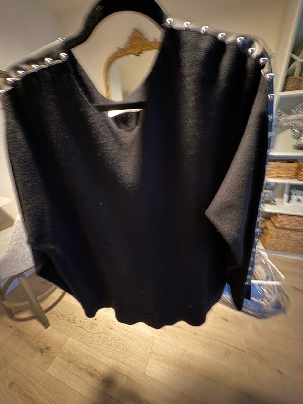 Black Marino wool with faux, leather stud, embellishments on arms